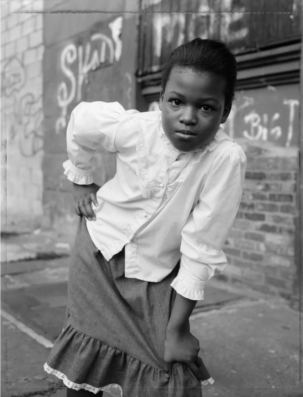 Dawoud Bey, A Young Girl Striking a Pose, Brooklyn, NY, from the series Street Portraits, 1988. Pigment print. Courtesy of the artist and Stephen Daiter Gallery, Chicago