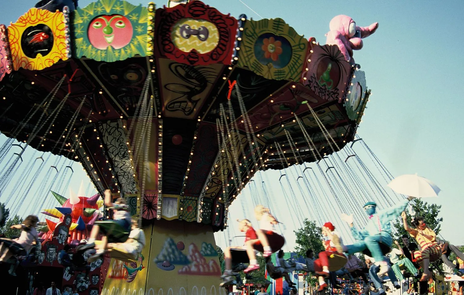 Kenny Scharf, painted chair swing ride. Luna Luna, Hamburg, Germany, 1987.