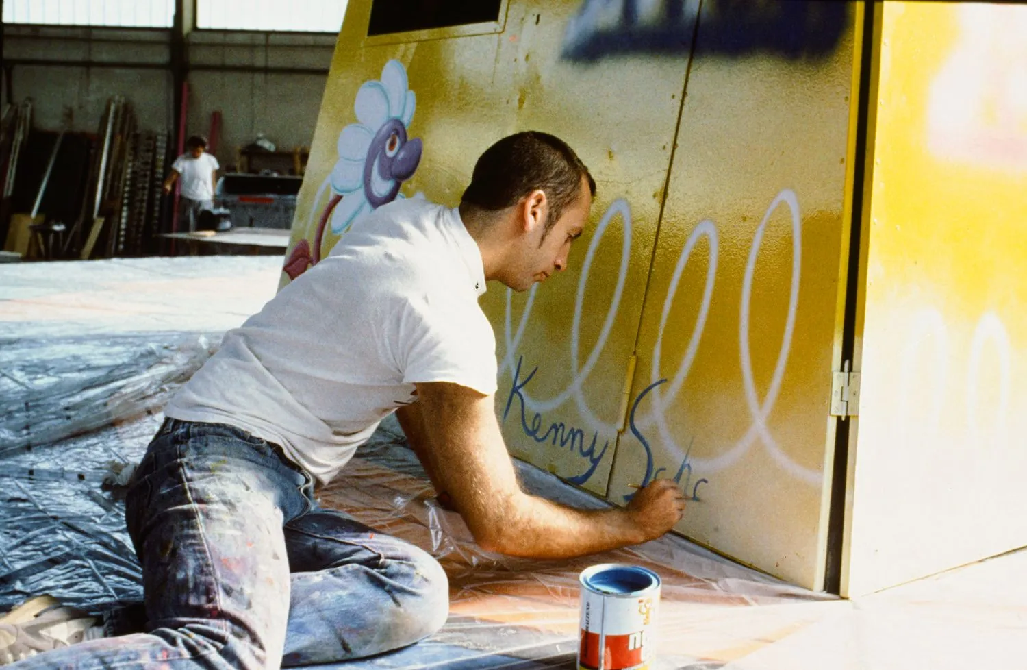 Kenny Scharf signs his painted chair swing ride