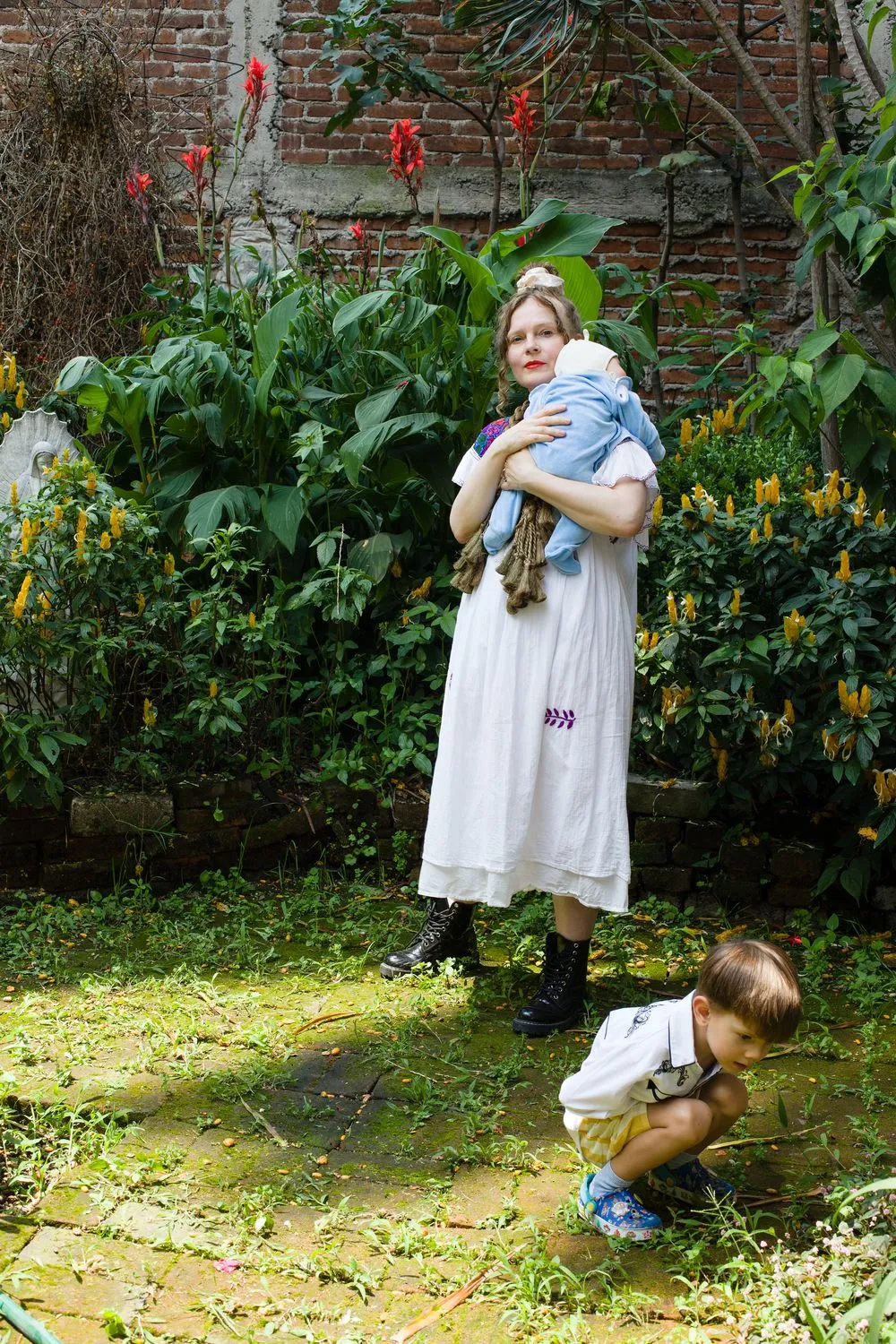 Merike Estna with her children in her studio in Mexico City in 2025. Photo by Aime Estna