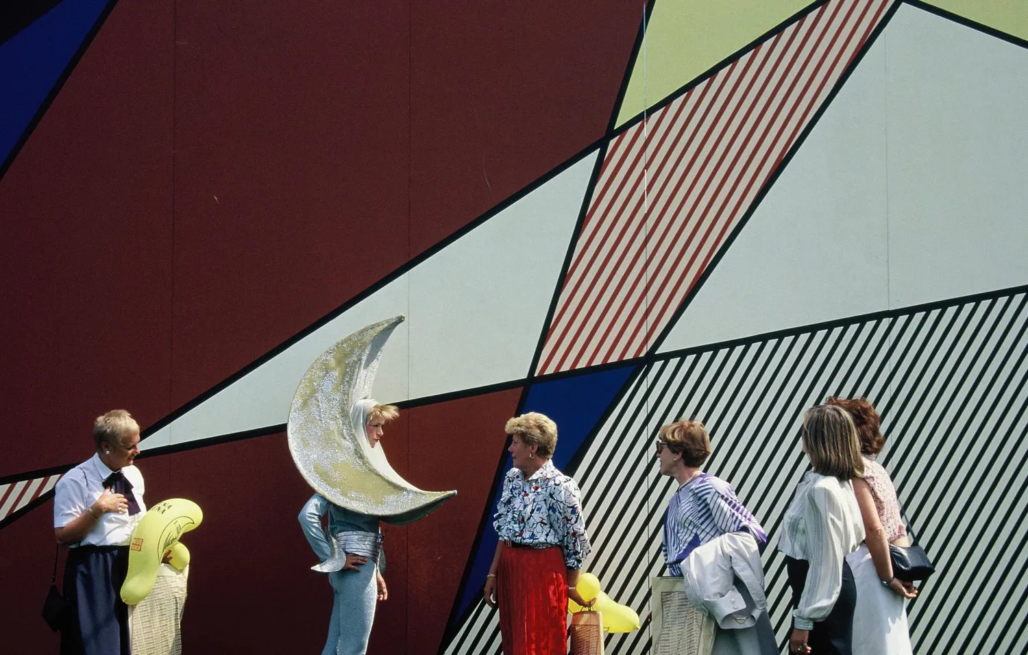 Performer in front of Roy Lichtenstein’s Luna Luna Pavilion. Luna Luna, Hamburg, Germany, 1987