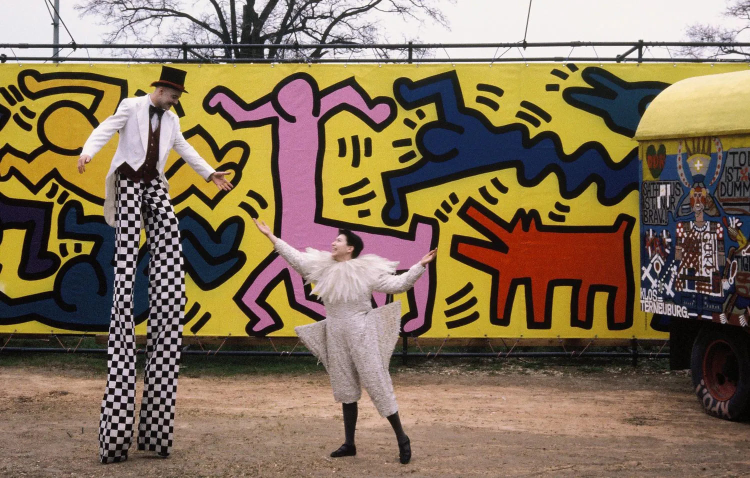 Performers in front of a Keith Haring tarp. Luna Luna, Hamburg, Germany, 1987