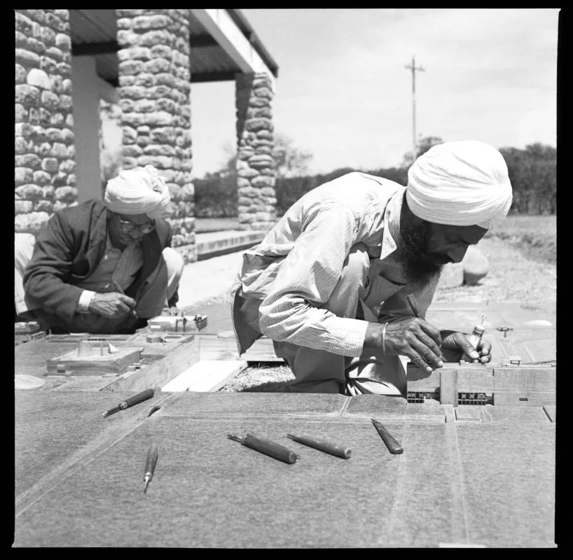 Pierre Jeanneret, a founder of Tropical Modernism, portrait of model makers, Rattan Singh and Dhani Ram, at work on the model for Capitol Complex, Sector 1, Chandigarh, India, circa 1960. Pierre Jeanneret fonds, Canadian Centre for Architecture. Gift of Jacqueline Jeanneret. © CCA