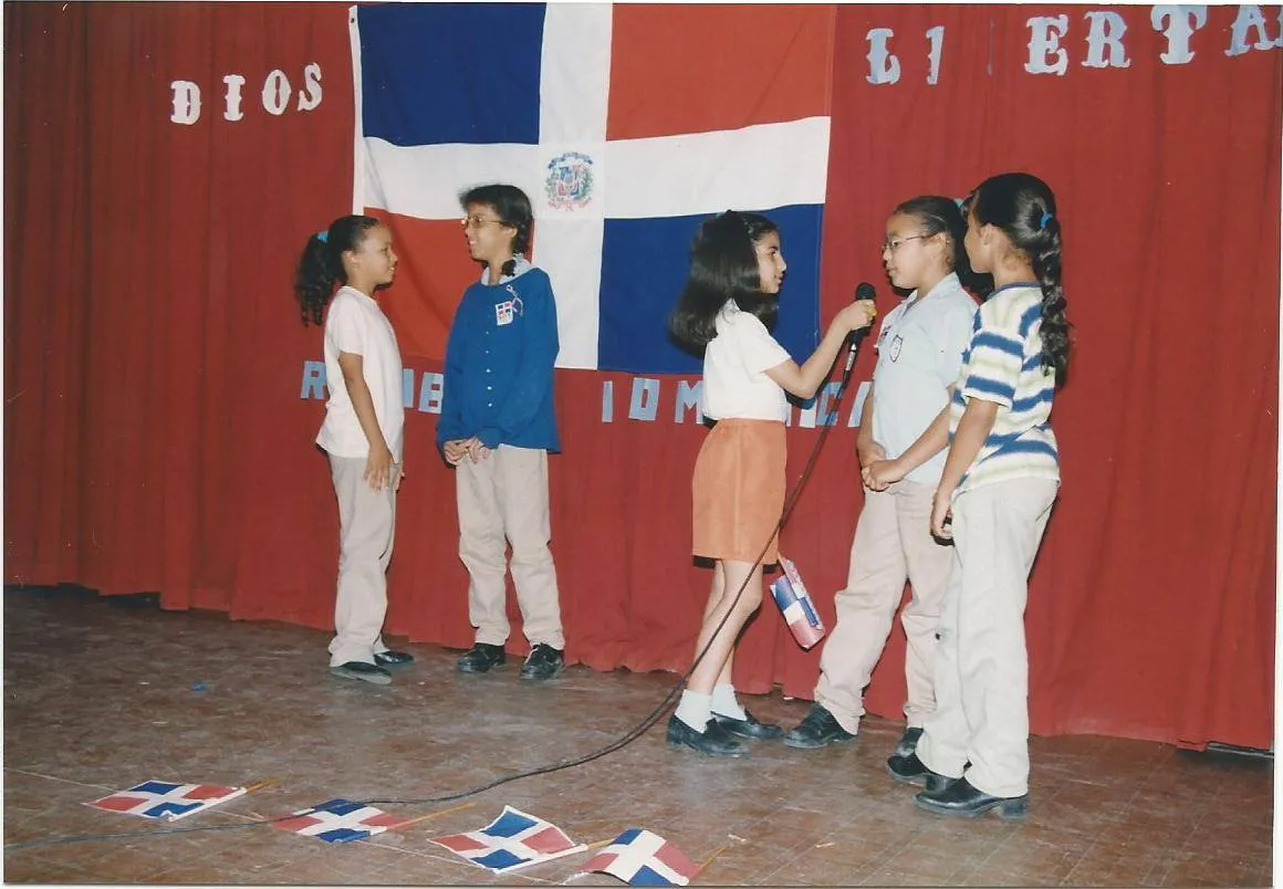 Primary school students play, interviewing classmates during the Dominican Independence Month. Credits- Escuela Madre Mazzarello alumni archives