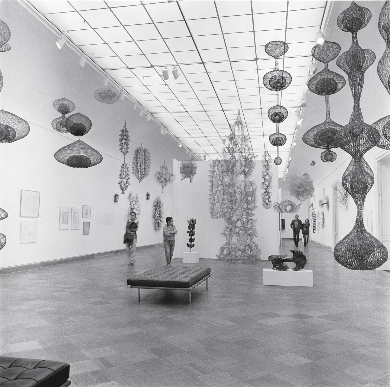 Ruth Asawa (second from left) with visitors to her exhibition Ruth Asawa: A Retrospective View, San Francisco Museum of Art (now SFMOMA), 1973