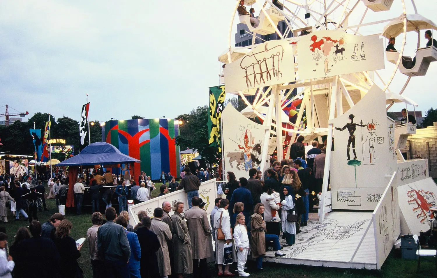 Visitors in line for Jean-Michel Basquait’s painted Ferris wheel. Luna Luna, Hamburg, Germany 1987