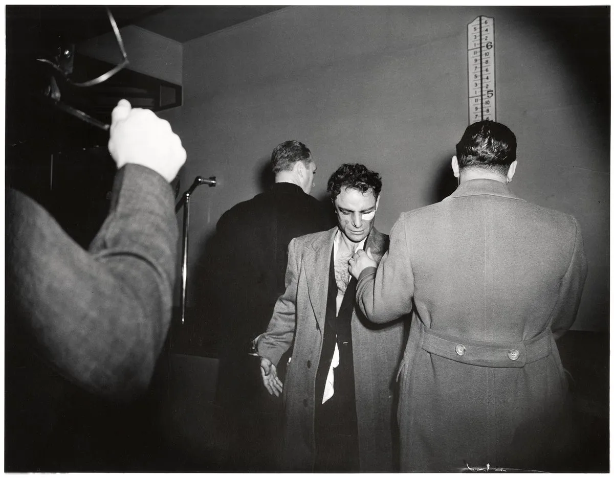Weegee, Anthony Esposito, booked on suspicion of killing a policeman, New York, January 16,
1941